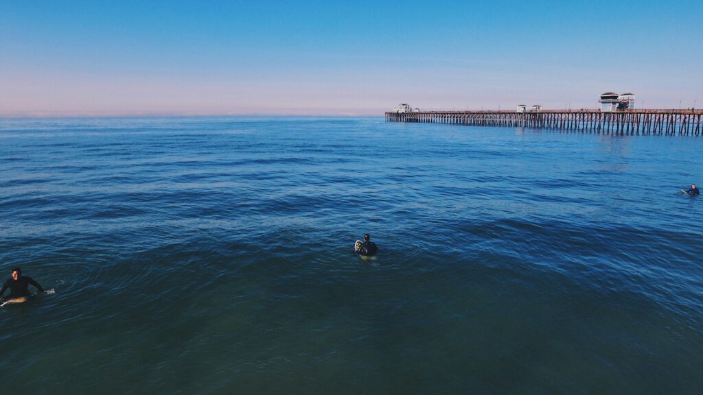 Enjoy swimming or surfing at Oceanside pier